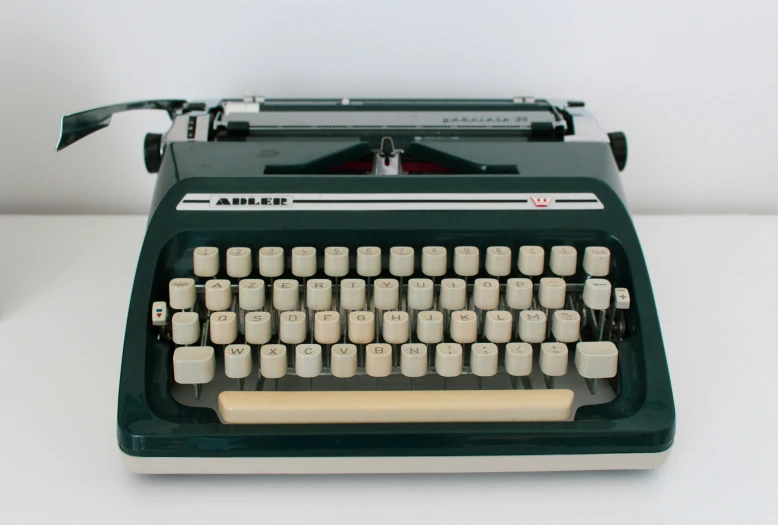 an antique typewriter with the screen open