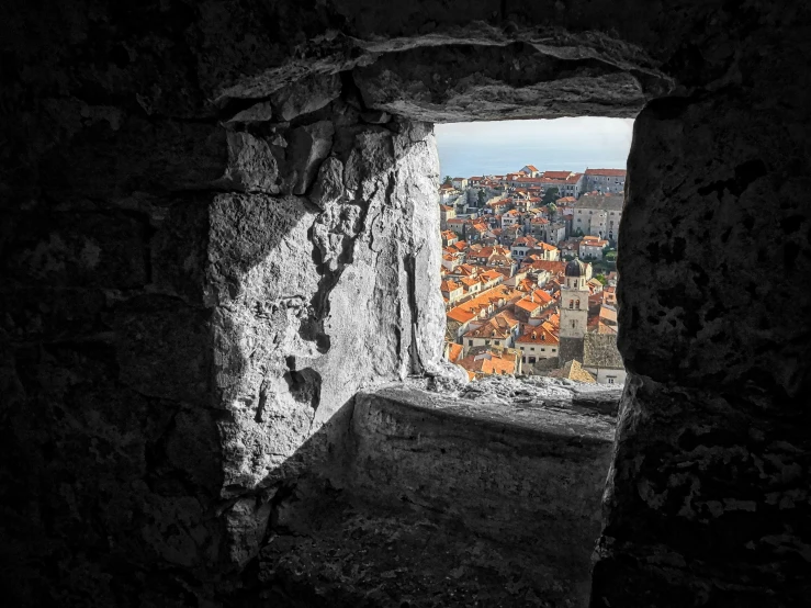 an aerial view out the window of a rock - filled building