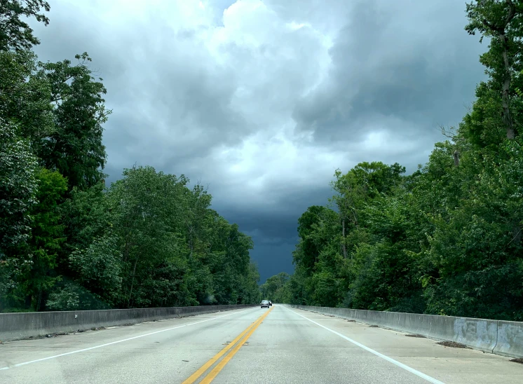 a car is driving down a dark street