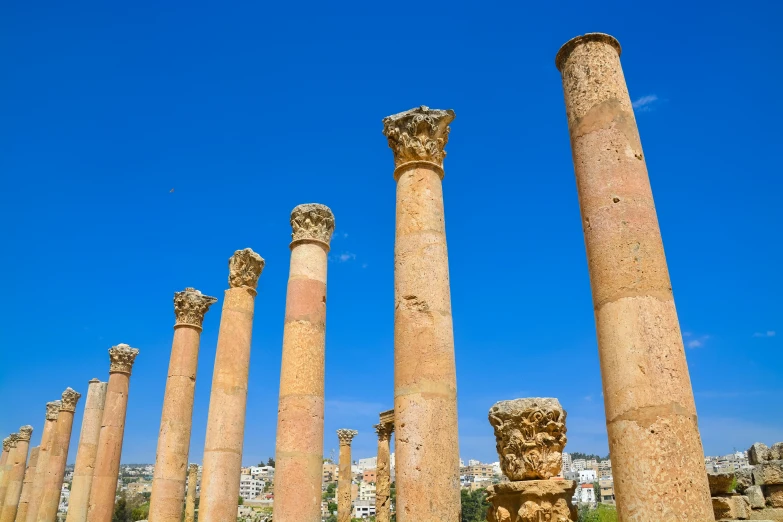 several large pillars with statues on top of them