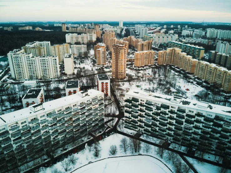 a winter scene in the city with lots of snow on the ground