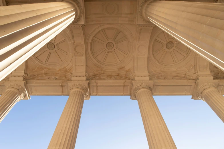 there are columns lined up with decorative designs on them