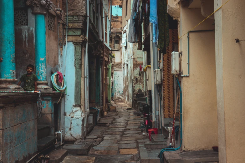 a stone street lined with small buildings