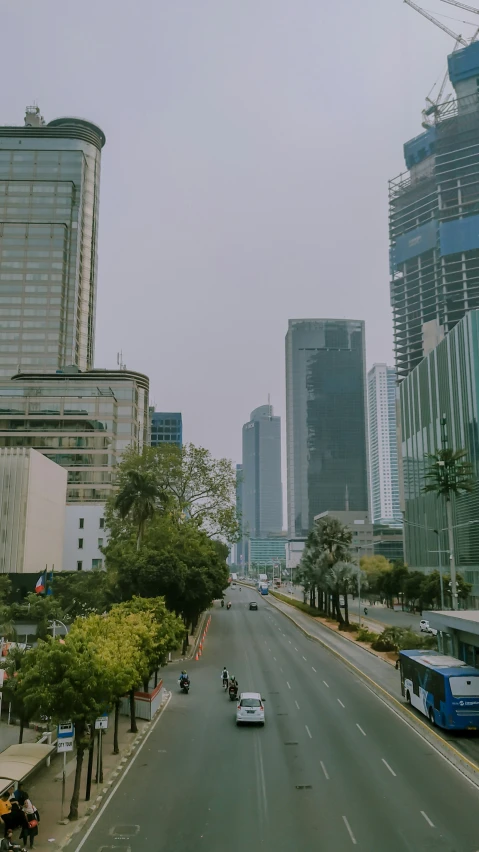 a highway that has cars and some buses on it