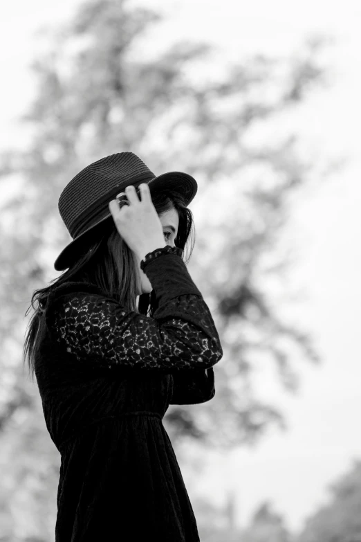 a young woman is talking on her cell phone