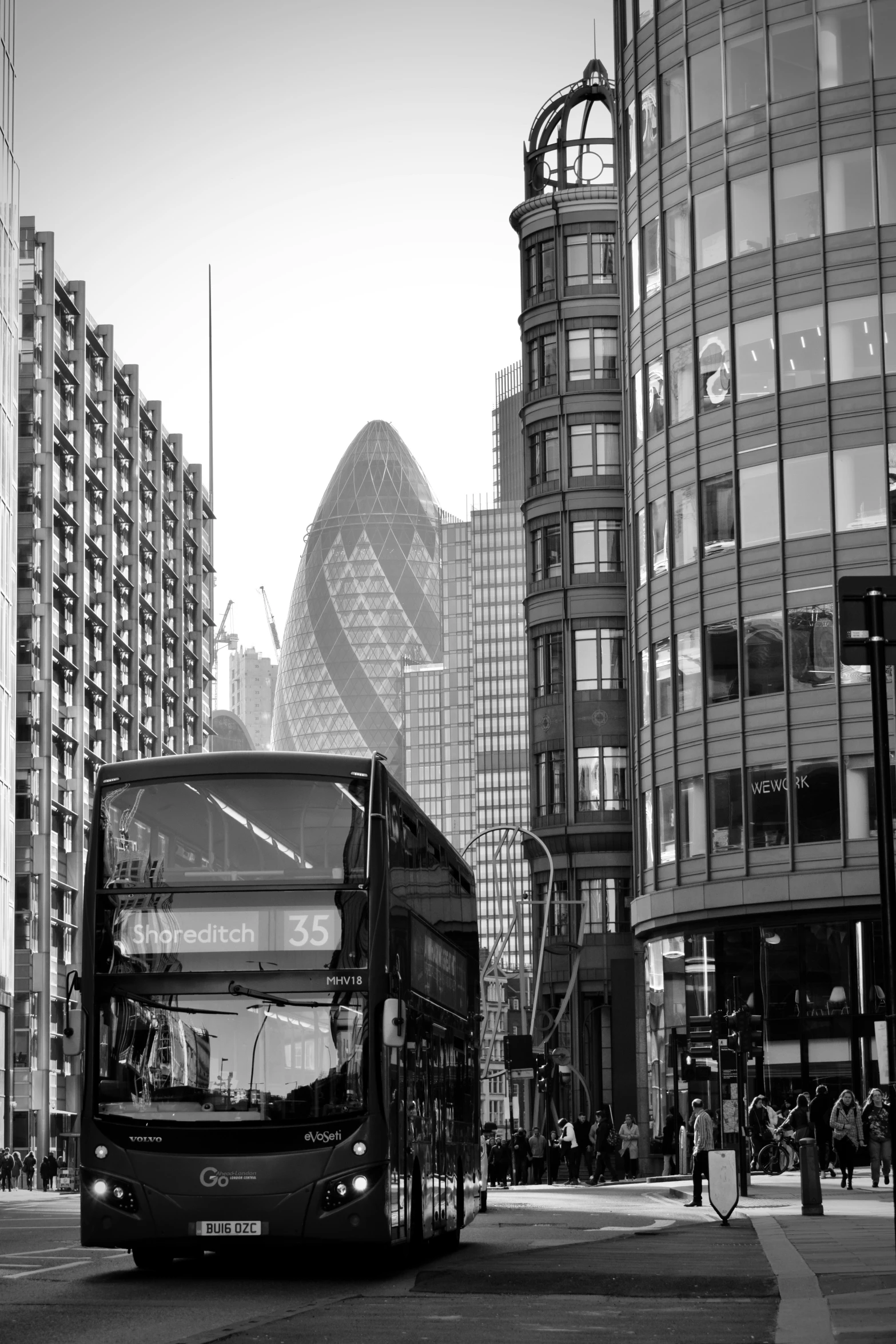 two black double decker buses parked next to each other