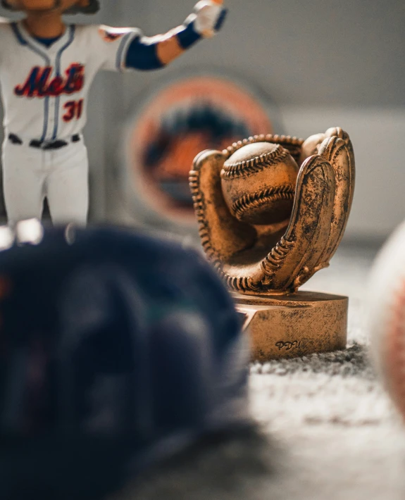 a closeup of a baseball glove and a glove on a base