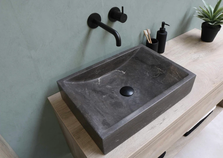 the bathroom sink is shown with two soap dispensers