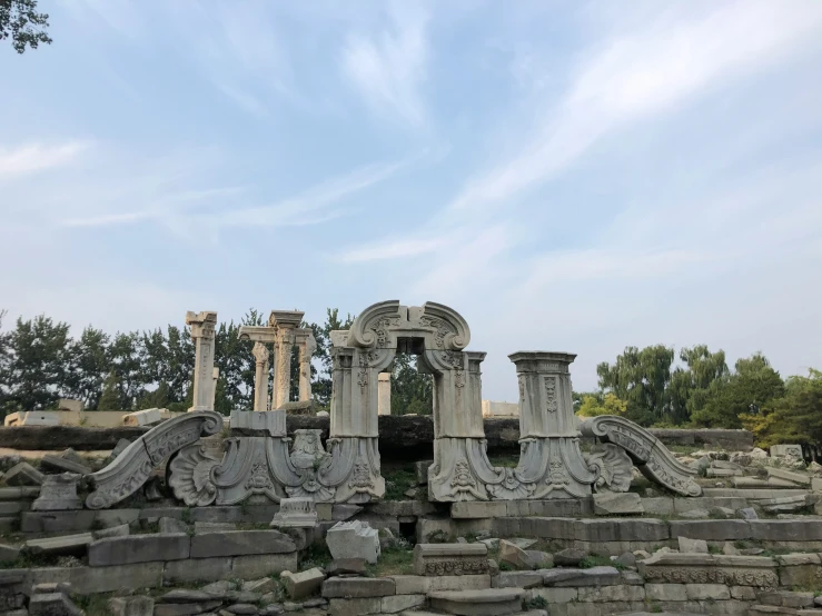 there is a building made from stone that has carved designs