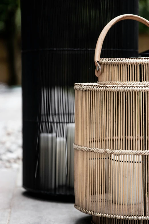 a large basket sitting next to two other woven containers