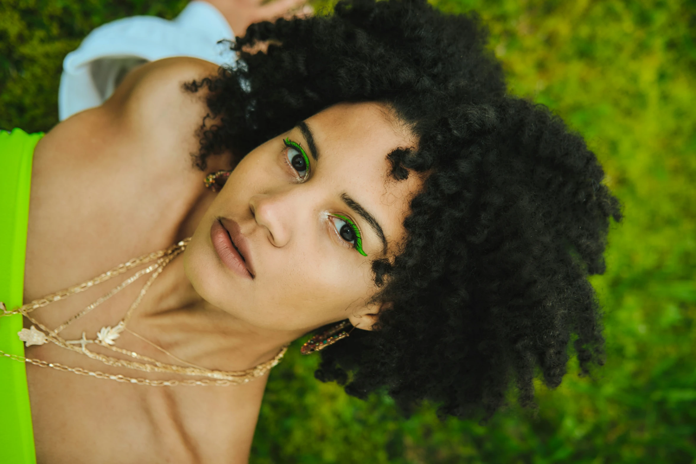 a woman with green eyes posing for a po