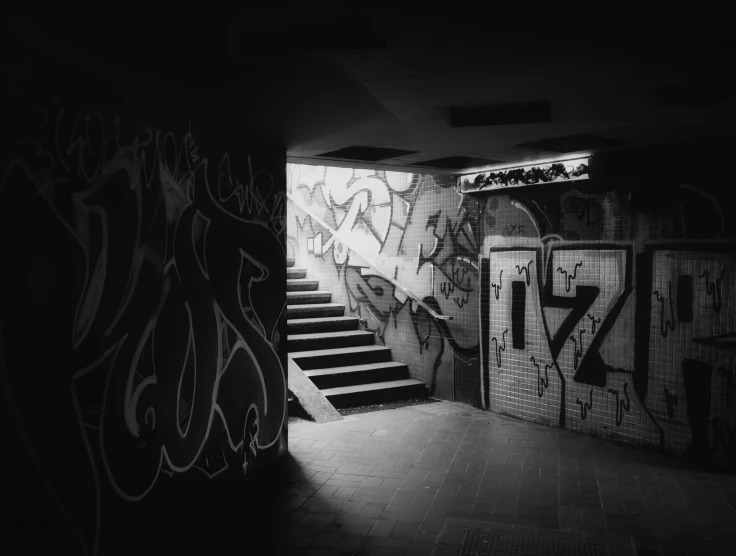 an empty room with some stairs painted black