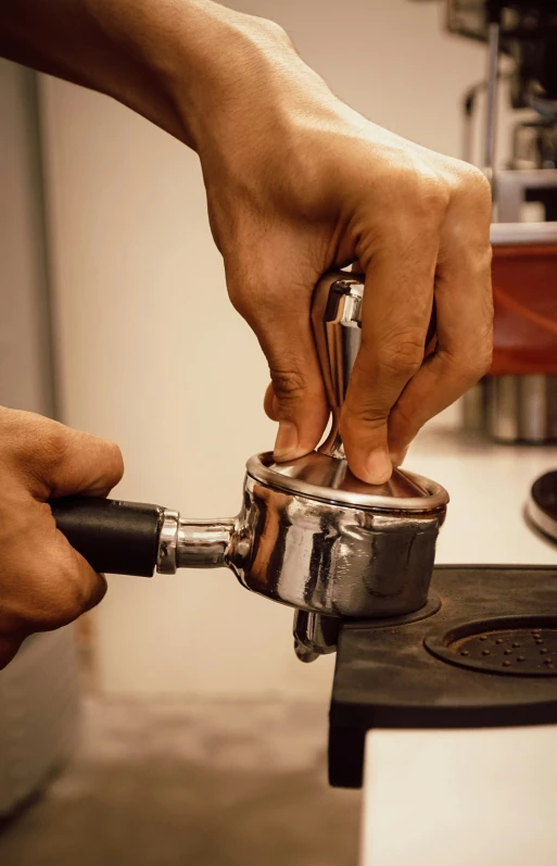 a person is using a grinder to trim soing on a table