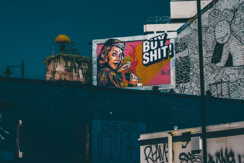 a graffiti art building with a blue sky background