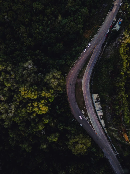 aerial s of the highway leading to a forested area