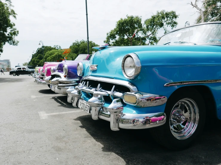 a row of cars parked in a parking lot