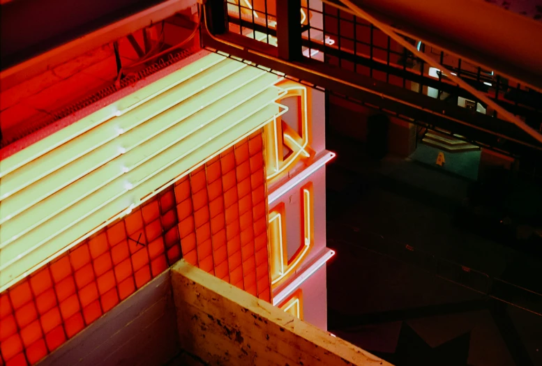 neon sign in the shape of the word love sits on the side of a building