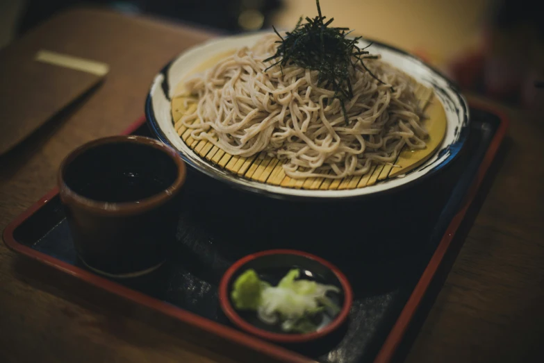 this meal consists of noodles and vegetables with dipping sauce