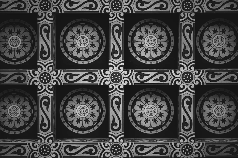 a black and white picture of a tiled surface