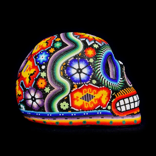 a close up of a brightly colored skull