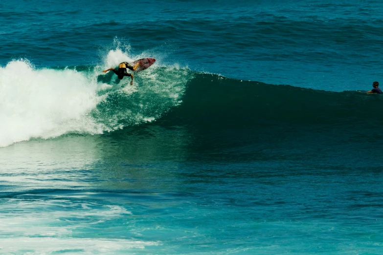 a surfer riding a large wave in the ocean