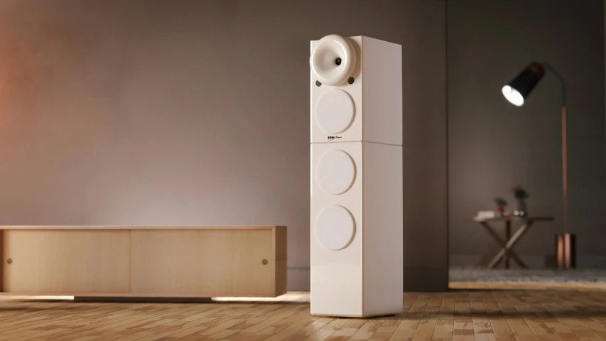 a white speaker sitting in the middle of a wooden floor