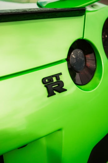 the back side of a lime green sports car