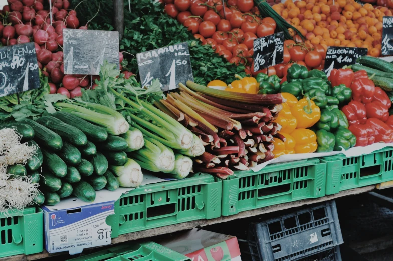 a produce section at a grocery store displaying a variety of fresh fruit and vegetables