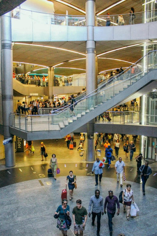 a group of people walking in a mall