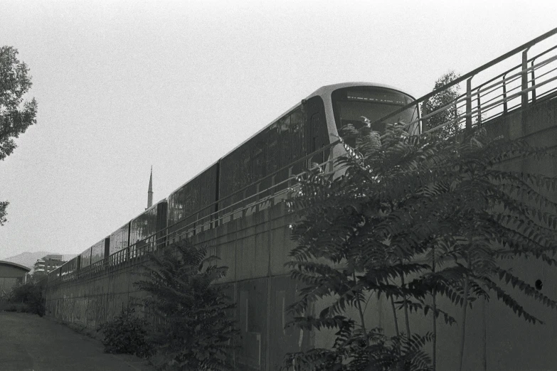 a black and white po of a train coming up the tracks