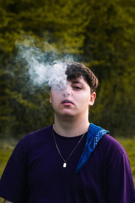 the boy is smoking a pipe and looking to the left