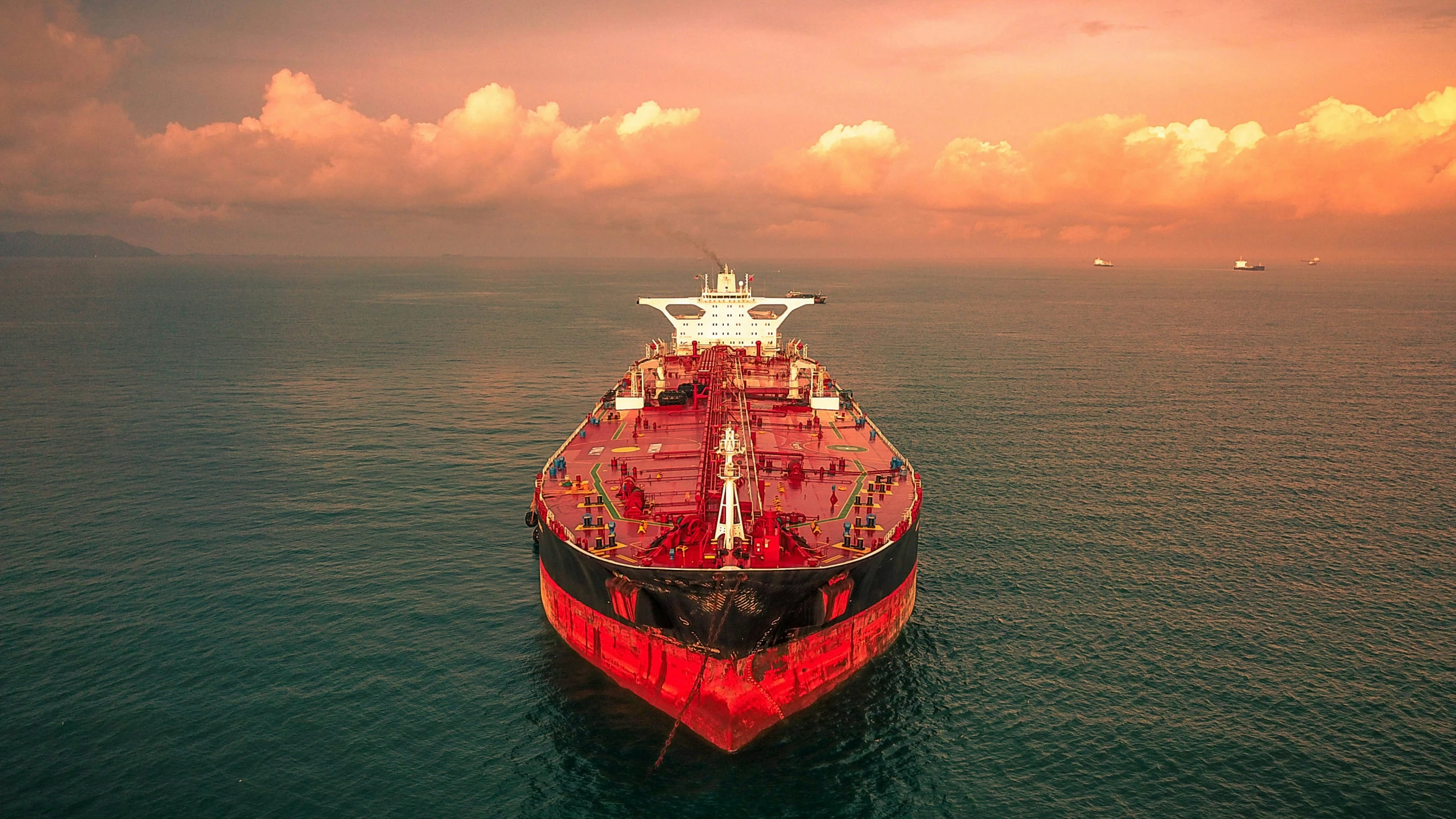 a large cargo ship in the middle of the ocean