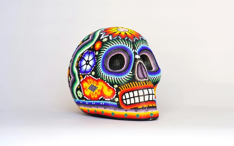 a colorful painted sugar skull made out of candy