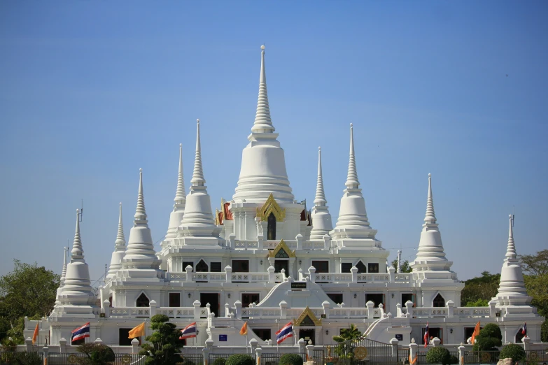 the white building has many spires on it