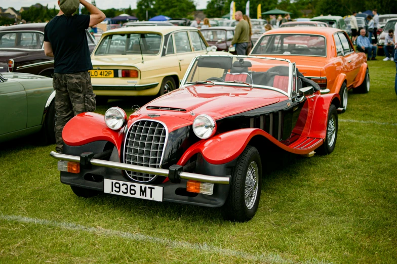 a group of cars on display at an event