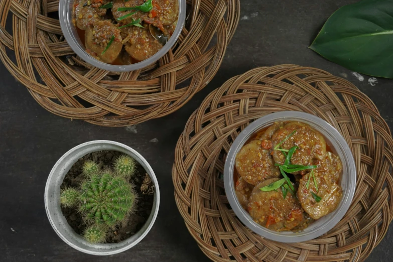 three bowls of some sort with some food in them