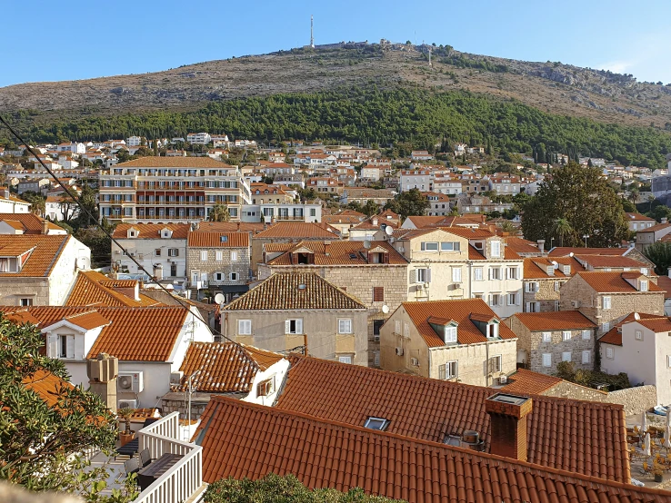 red roofs sit on the rooftops of a town