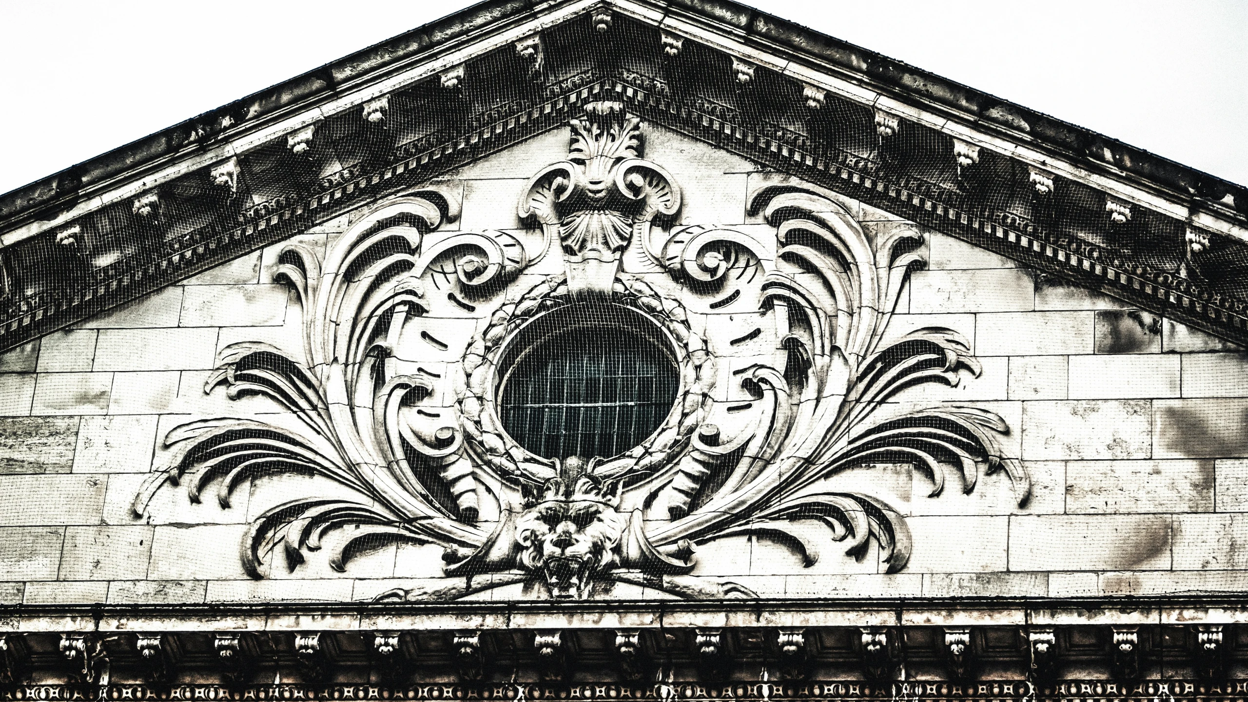 an old stone building with a decorative design on it