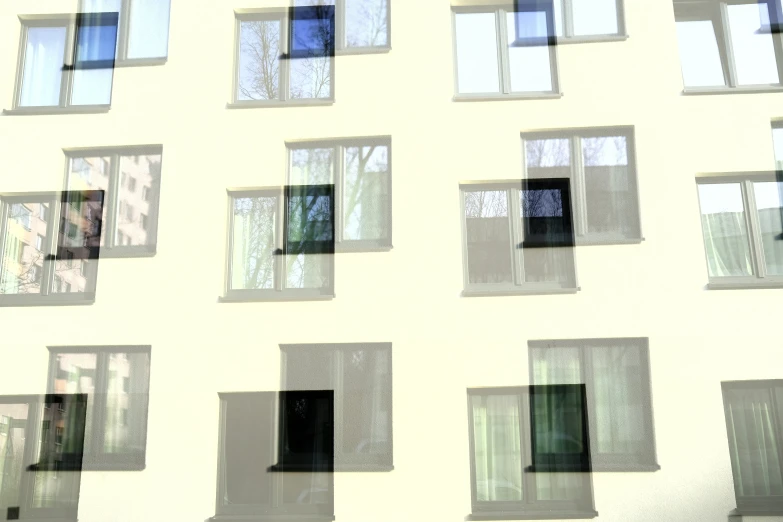 many square windows are seen on a white wall