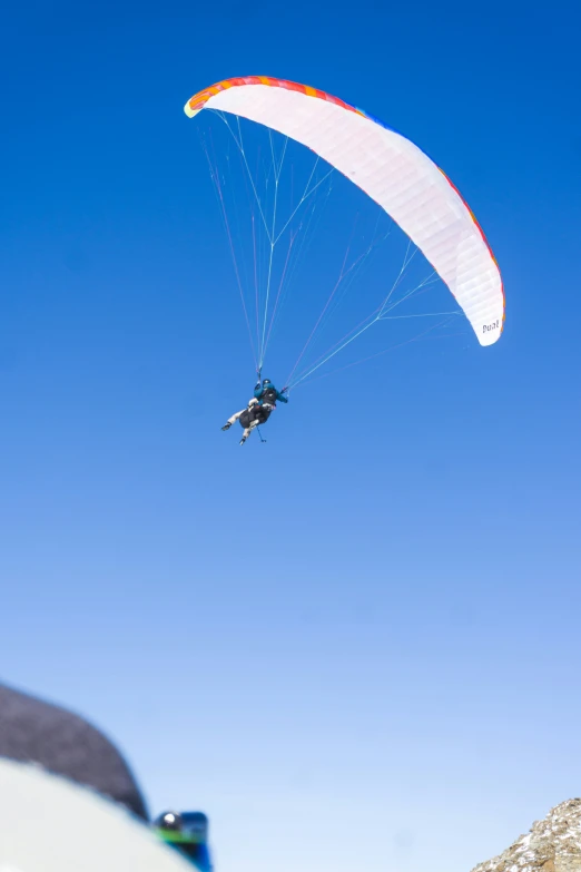 person being pulled through the air with a parachute