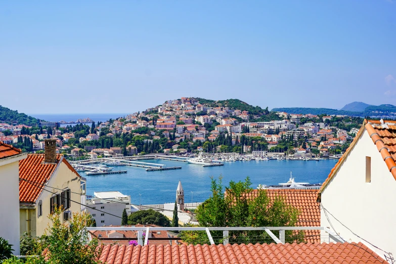 a couple of houses near one another and a large body of water