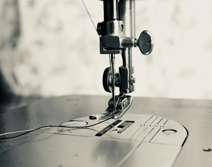 a sewing machine sitting on top of a wooden table