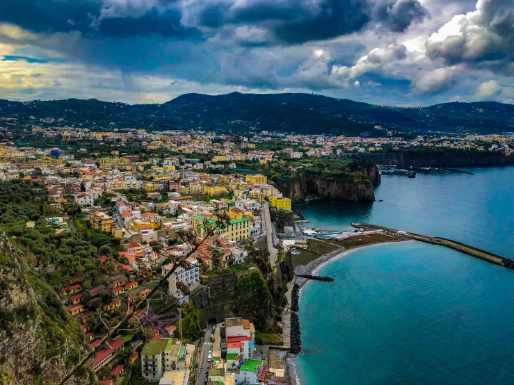 a city by the sea under storm clouds