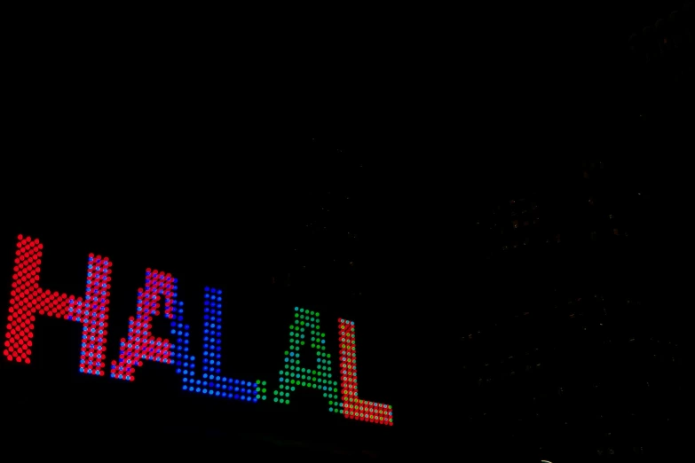 lights on a building advertising the name jala hah