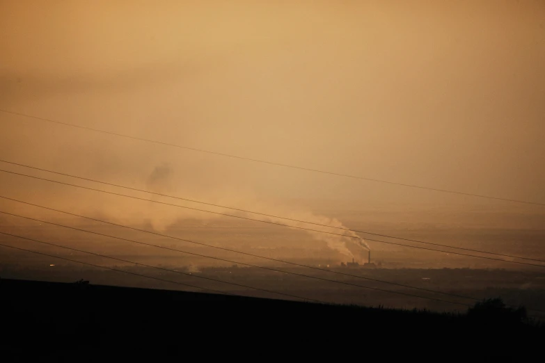 silhouettes against a dusky sky on an overcast day