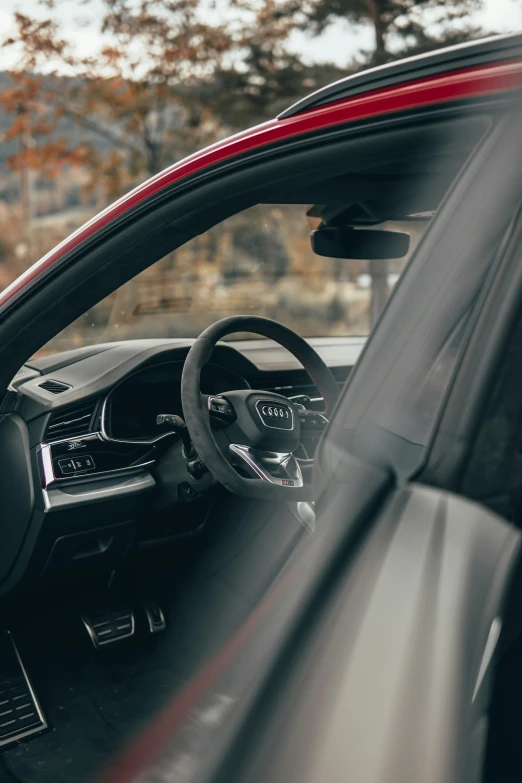 interior of modern, black sport car in an urban area