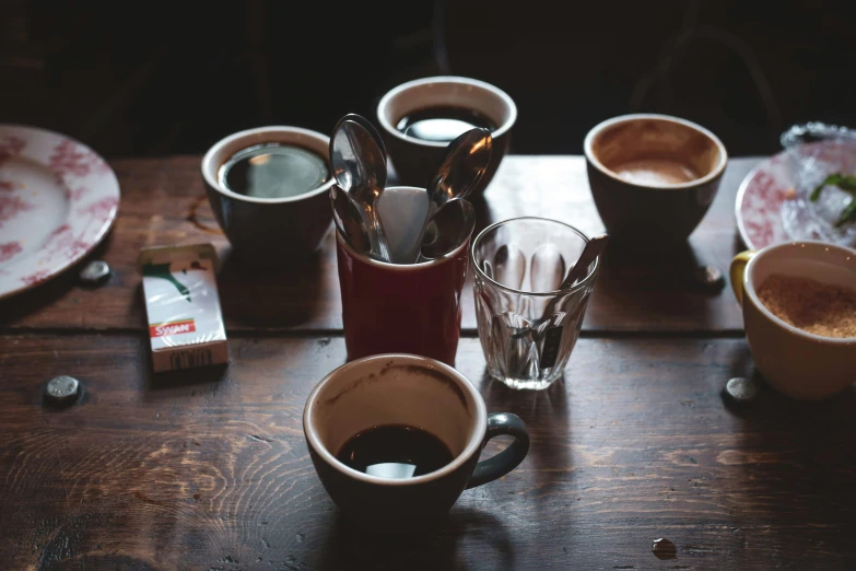 there is many different cups on this table