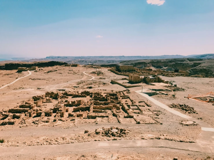 a small town is surrounded by desert vegetation