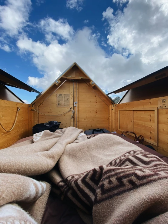 an area with some very large blankets and wood