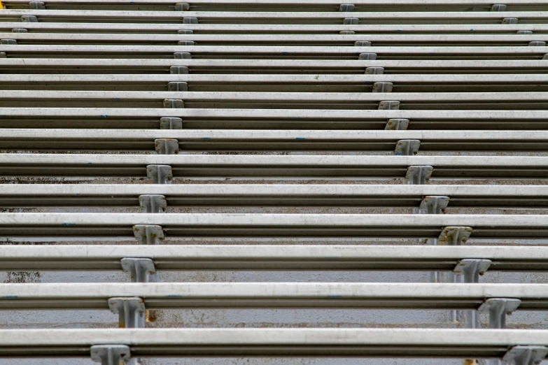 rows of empty seats sitting in a stadium